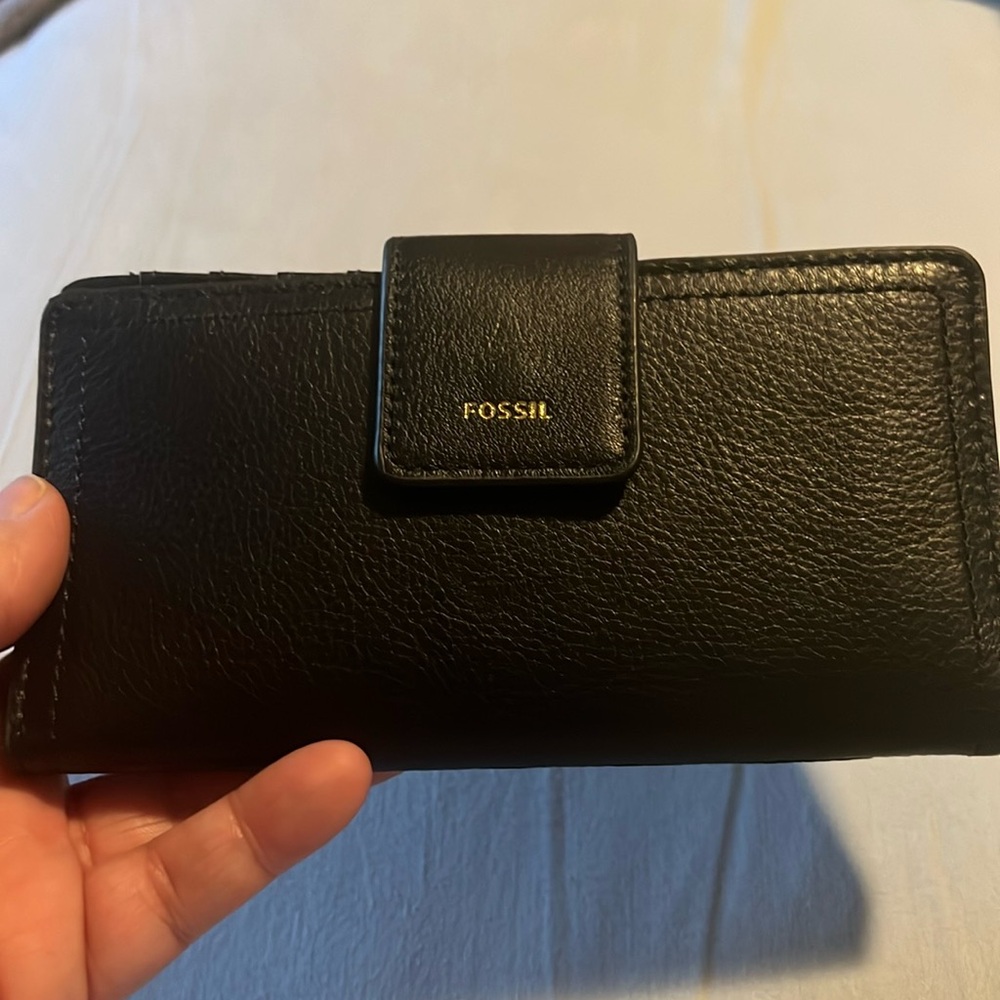 Brand new black leather Fossil check book wallet. Comes from a smoke free home.
